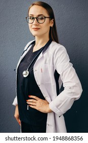 Girl Doctor Nurse In Medical Clothes Beautiful Smiling Cheerful Neat Portrait On A Solid Background