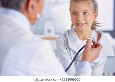 Girl and doctor with stethoscope listening to heartbeat - Powered by Shutterstock