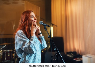 Girl Does Exercises With Lips At Chants In Vocal Lesson Near The Microphone