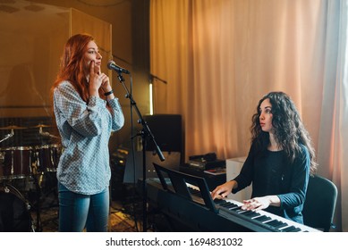 Girl Does Exercises With Lips At Chants In Vocal Lesson With Piano Accompaniment