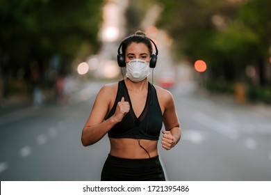 girl does sports with mask on the street during coronavirus - Powered by Shutterstock