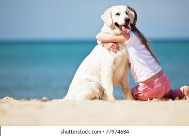 The Girl With The Dog On The Shore Of The Sea. The Child And A Dog.