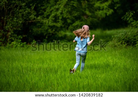 Small child with long blond hair