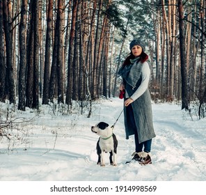 Girl With A Dog In The Woods For A Walk. Winter