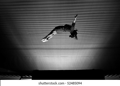 Girl Doing Backflip On Trampoline