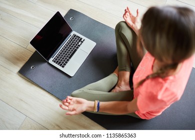 Girl doing exercise fitness at home with tablet - Shutterstock ID 1135865363