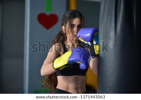 girl doing exercise and kickbox in the gym