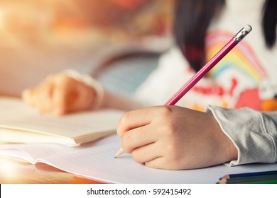 girl doing her homework.