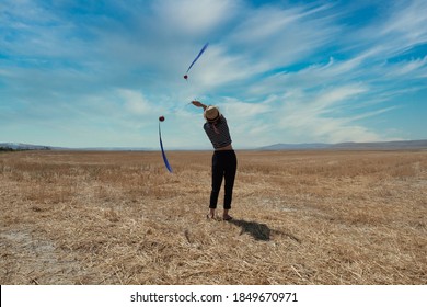 Girl Doing Poi On A Field