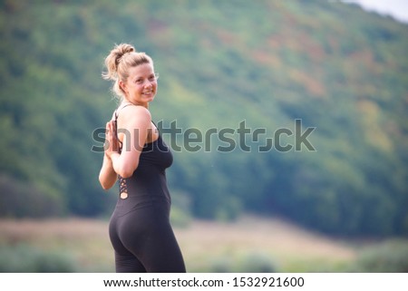 Similar – Woman in sports wear with earphones looking smartphone