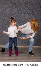 Girl With Down Syndrome Playing With Mom