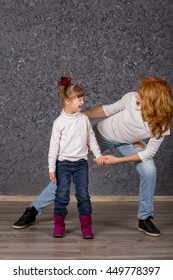 Girl With Down Syndrome Playing With Mom