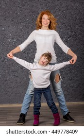 Girl With Down Syndrome Playing With Mom