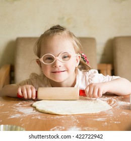 Girl With Down Syndrome Unrolls Dough