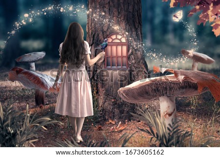 Girl in dress with bird in hand in fantasy enchanted fairy tale forest with giant mushrooms, magical shining window in pine tree hollow and flying magic butterfly leaving path with luminous sparkles
