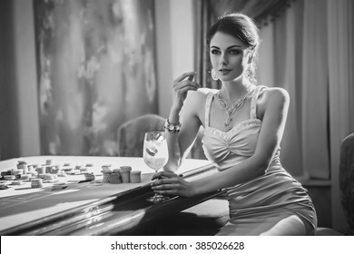 Girl Drinking Cocktail In Casino