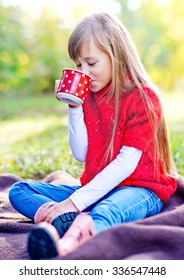 Girl Drinking Tea In Nature