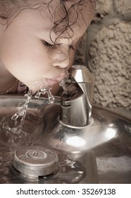 Girl Drinking From A Water Fountain