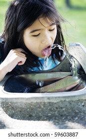 Girl Drinking From Water Fountain