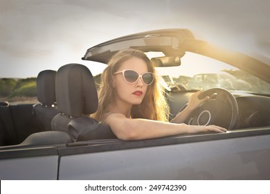 Girl Driving A Car 