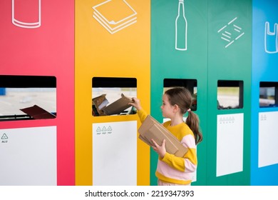 Girl dumping cardboard in bank for reduce, reuse, recycle. National Recycling Day. concept of care for the environment and build sustainable future. - Shutterstock ID 2219347393