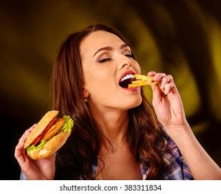 Girl Eat With Appetite Fastfood Big Hamburger And Fried Potatoes.