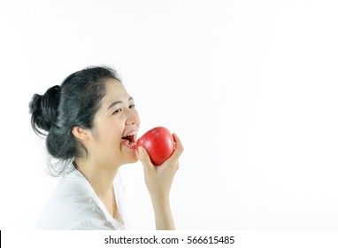 A Girl Is Eating An Apple.