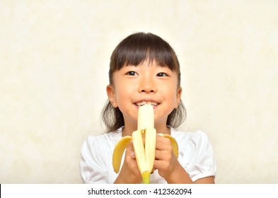 Girl Eating Banana