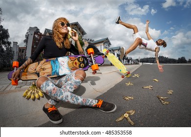 Girl eating banana and Guy on banana slip