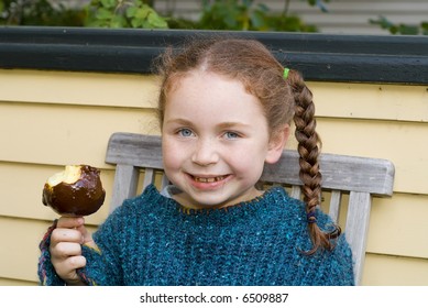 Girl Eating Carmel Apple