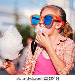 Girl Eating Cotton Candy