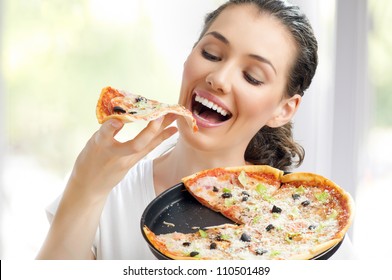 Girl eating a delicious pizza