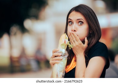 
Girl Eating A Disgusting Sandwich Feeling Sick. Nauseated Woman Tasting A Spoiled Snack On The Go
