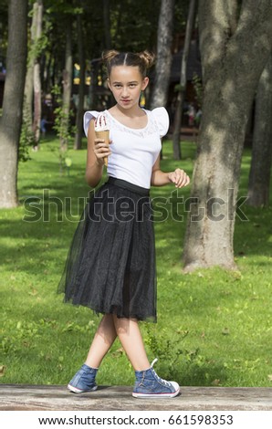 Girl eating ice cream in the park