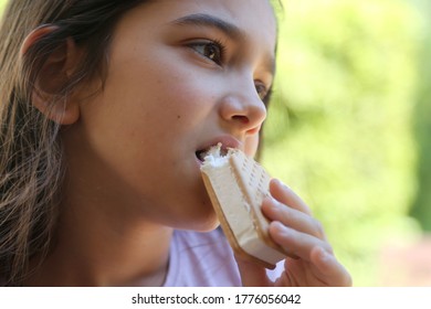 Girl Eating Ice Cream Sandwich