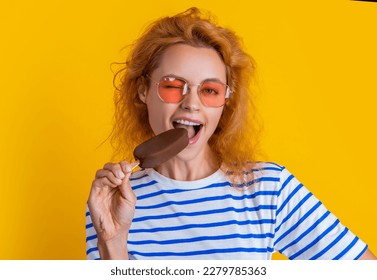 girl eating icelolly ice cream on background. photo of girl with icelolly ice cream at summer.