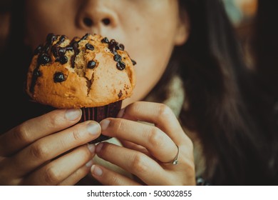 Girl Eating Muffin