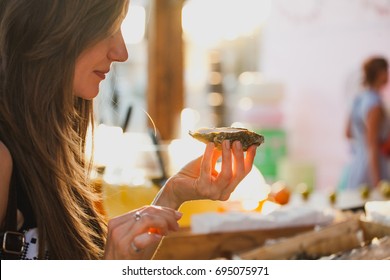 Girl Eating Oysters