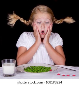 Girl Eating Peas With Bugs On The Table Isolated On Black