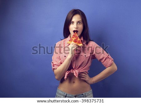 girl eating pizza