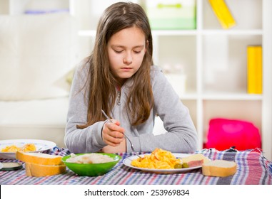 Girl Eating Scrambled Eggs For Breakfast