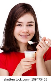 Girl eating yogurt isolated on white background