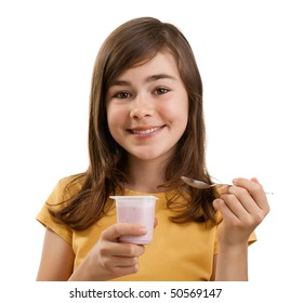 Girl eating yogurt isolated on white background