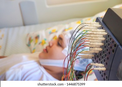 Girl with EEG electrodes attached to her head