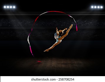 Girl engaged art gymnastics at sports hall - Powered by Shutterstock