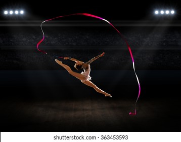 Girl engaged art gymnastics at sports hall - Powered by Shutterstock