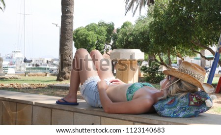 Girl enjoying her time on the beach while resting