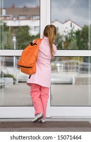 Girl Entering The School Building