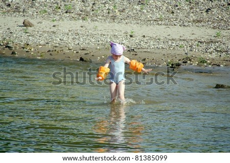 Girl entering the water