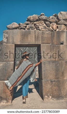 A Girl at the Entrance of ruins of Ollantaytambo Ruins in Sacred Valley of Peru. travel Concept